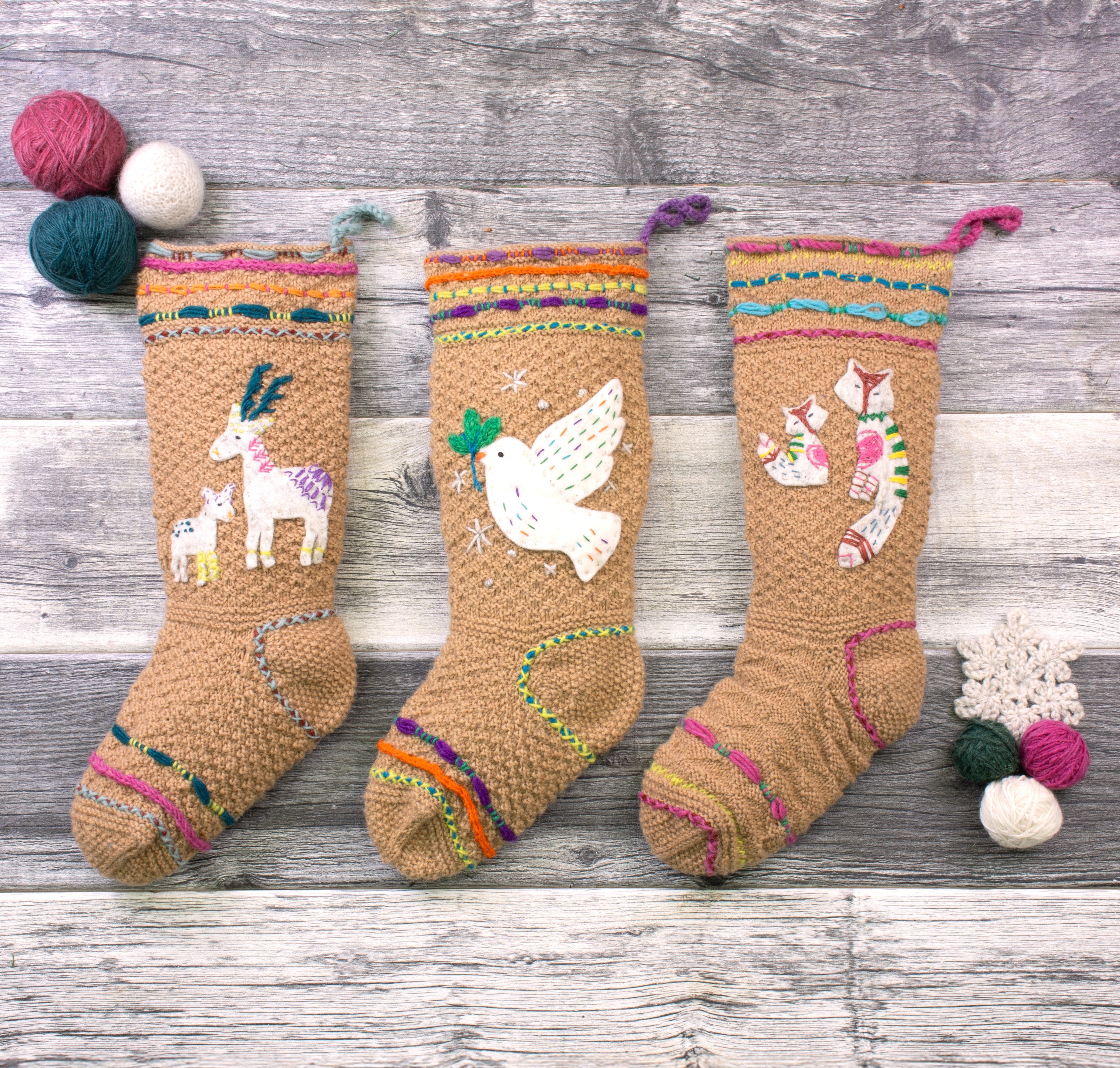 Hand-knit wool Christmas stockings trio with deer, dove, and fox appliqués, Fair Trade and handmade in Nepal.