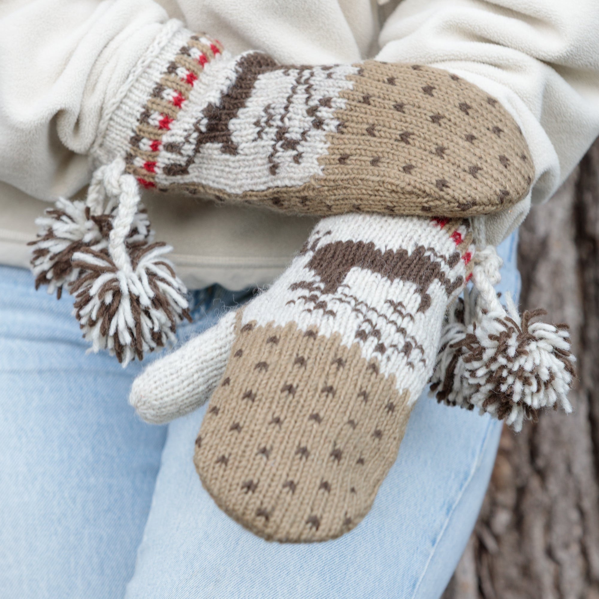 Festive pair of knitted mittens deer motif. 