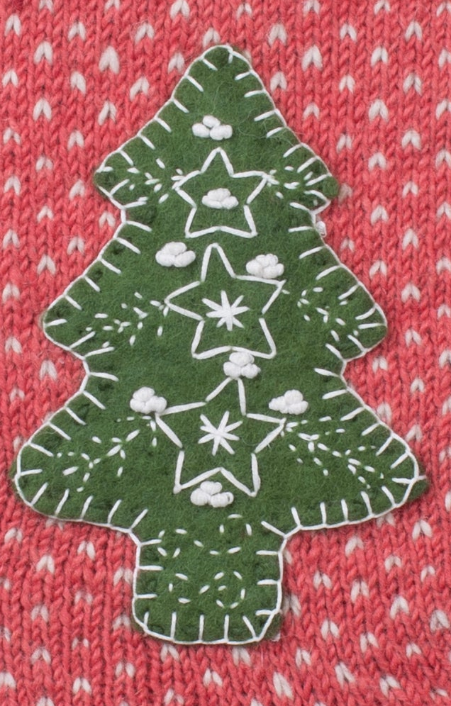 Close up Hand-knit wool Christmas stocking with Dala horse appliqué, handmade in Nepal, Fair Trade.